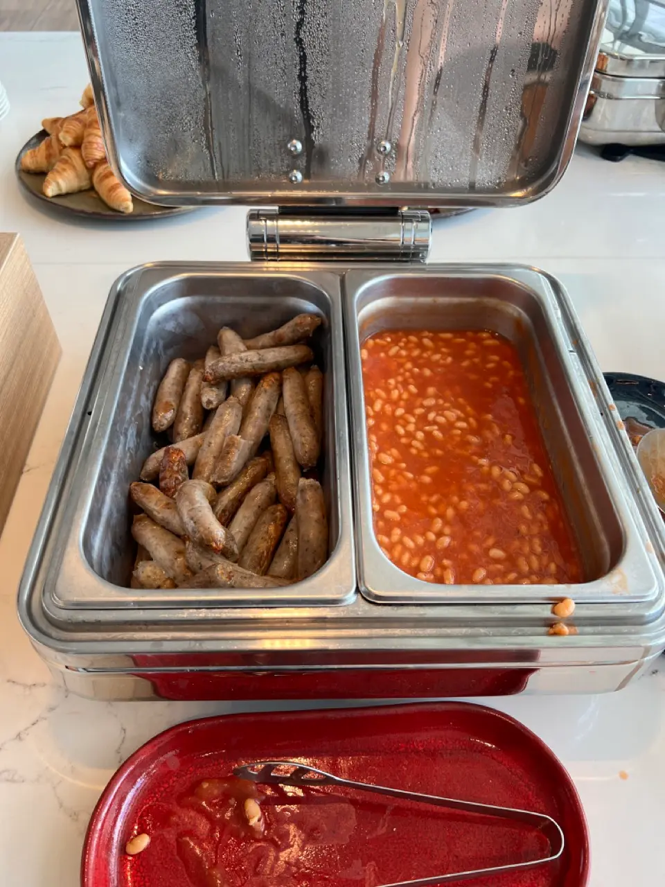 Qantas lounge sausage and baked bean